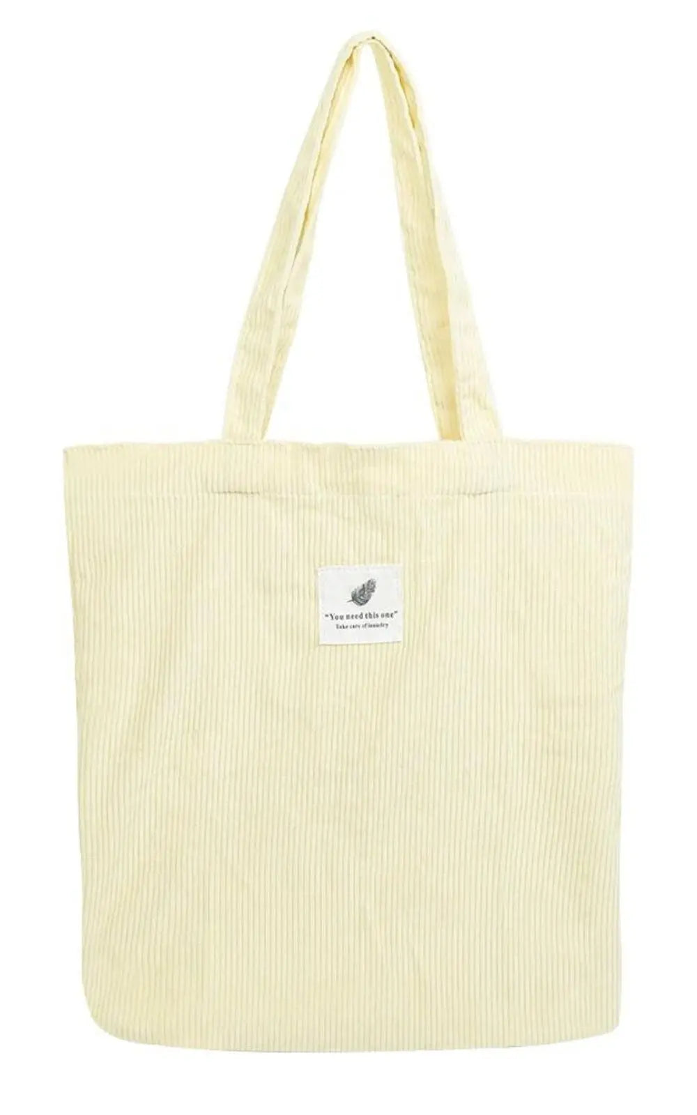 Sac en velours côtelé beige, accessoire tendance pour femmes, idéal pour compléter vos tenues décontractées.
